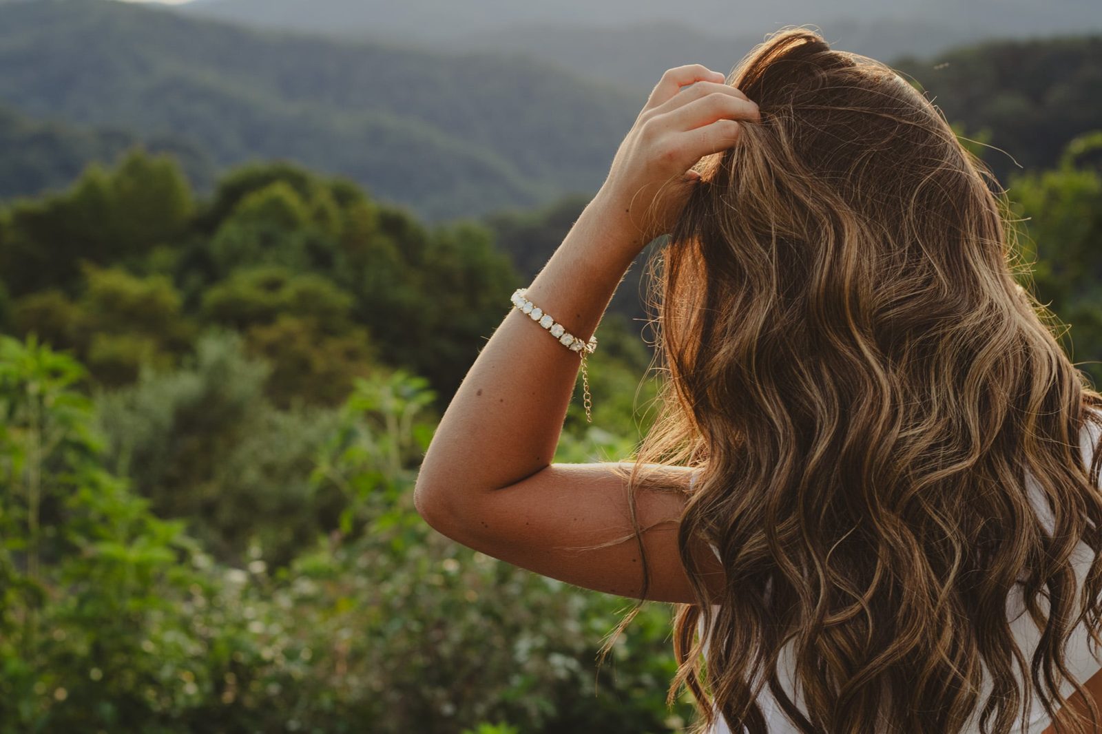 Senior portrait among green hills