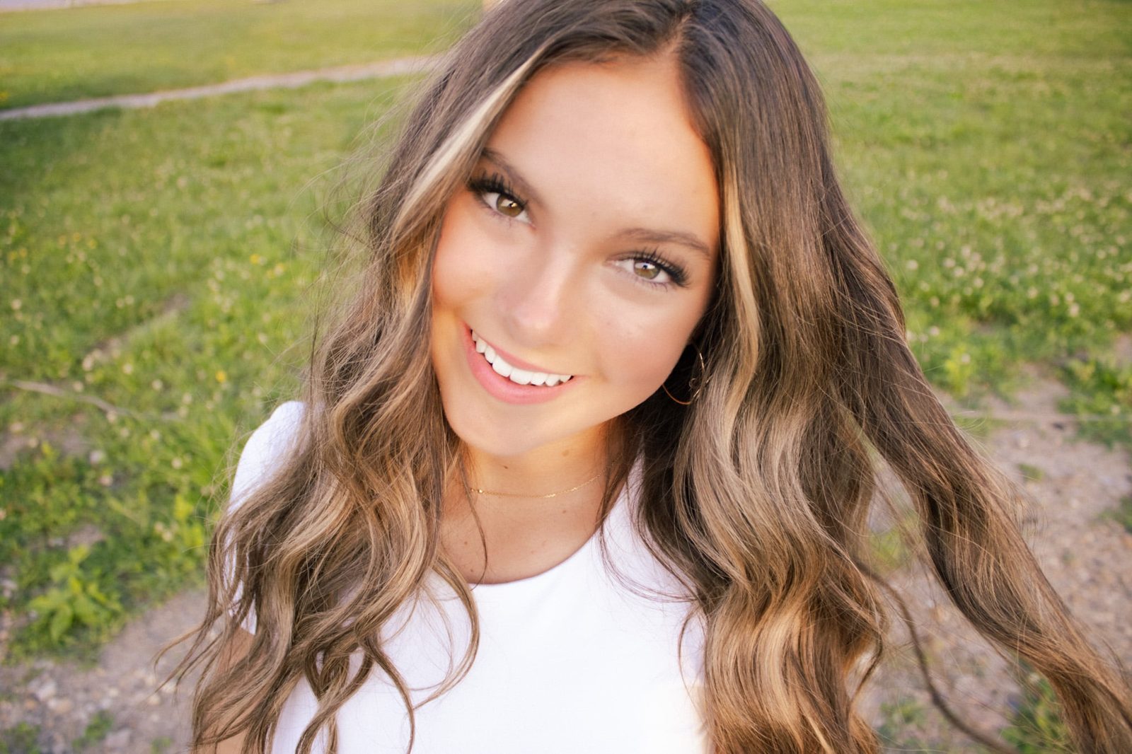 Close-up senior portrait in a field