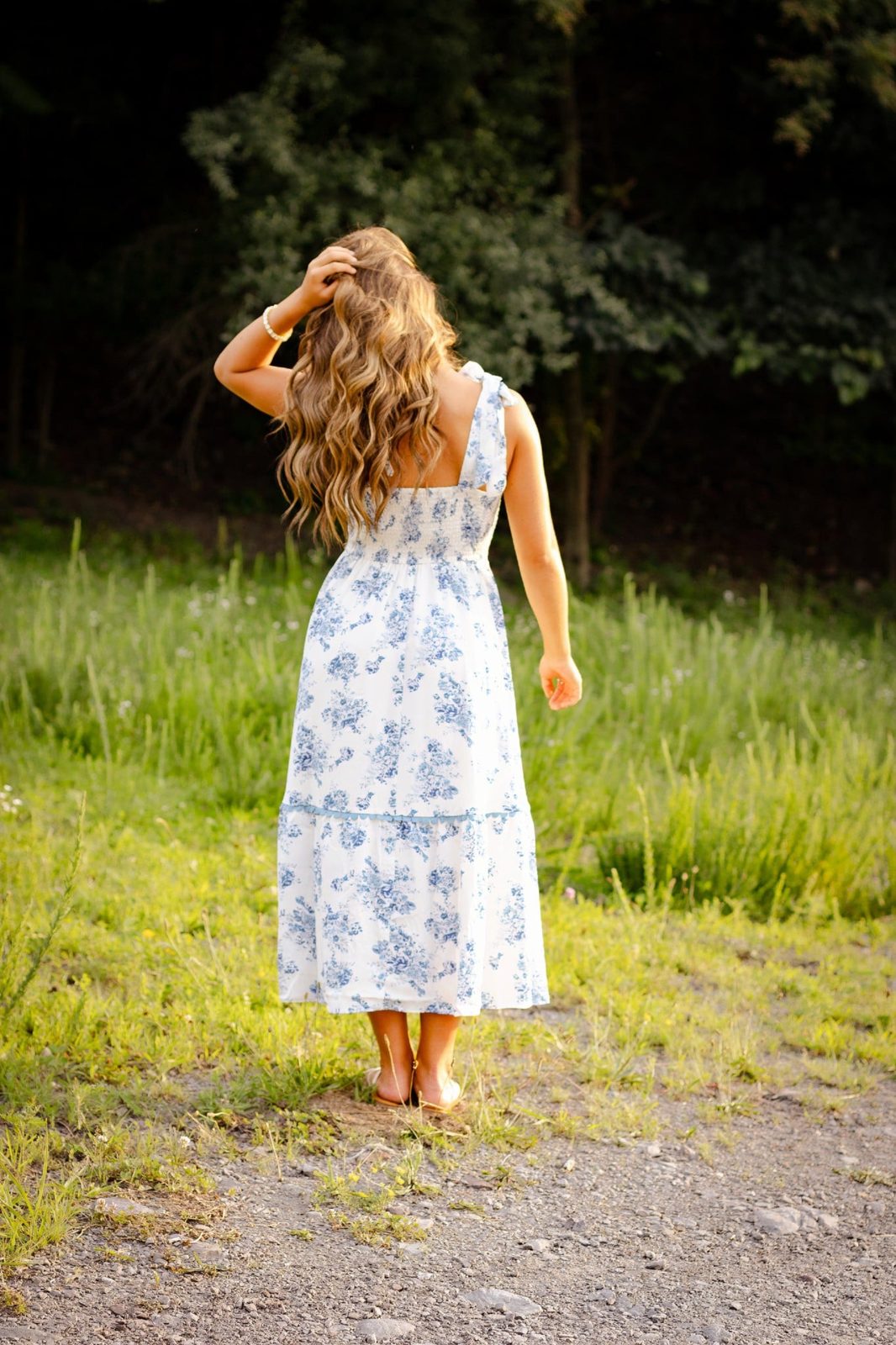 Senior walking away down a quiet path